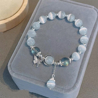 Soft Glow Beaded Bracelet with Butterfly Accent